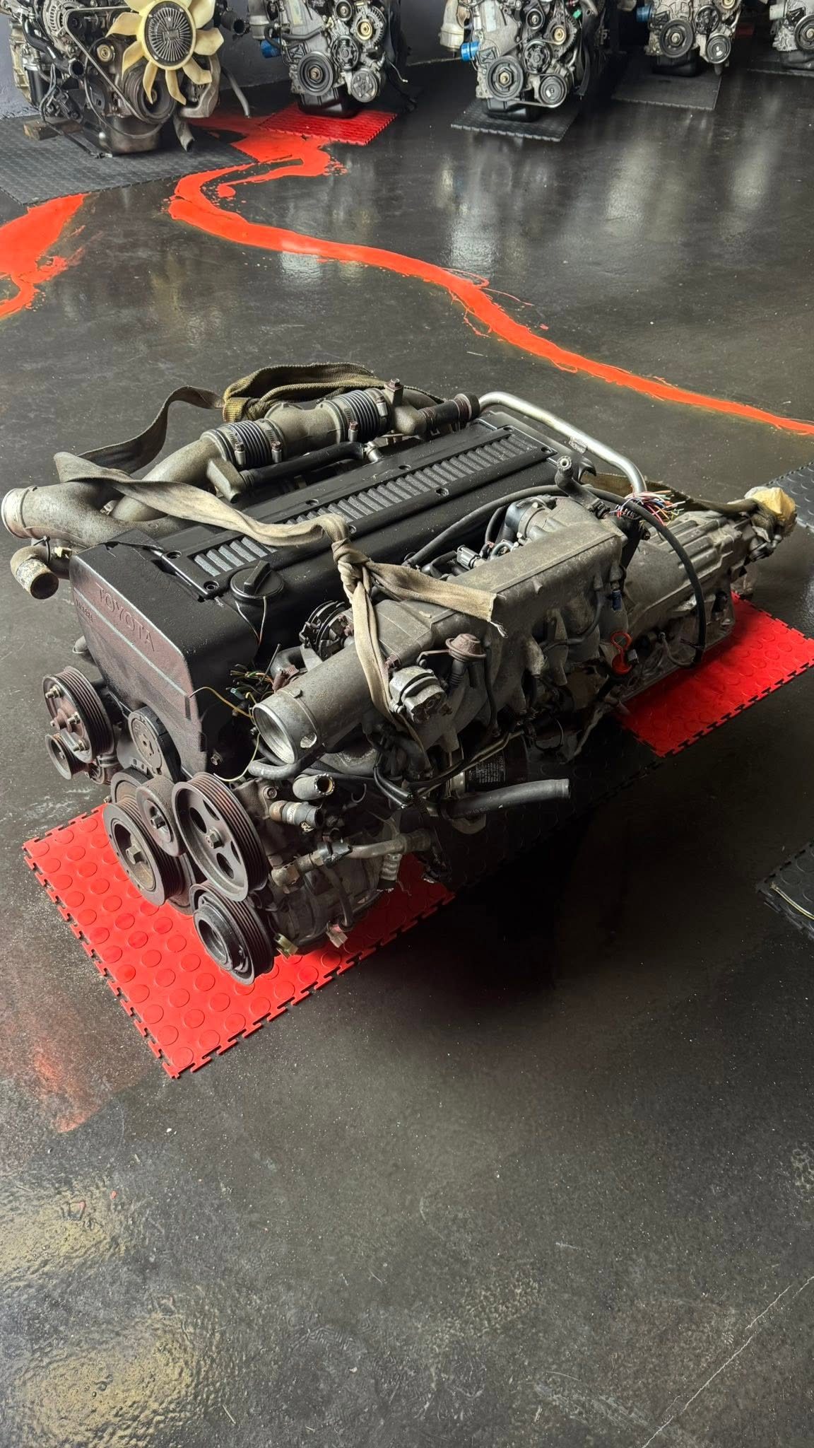 Imported Toyota 1JZ-GTE engine on the workshop floor at Engine Importers CT