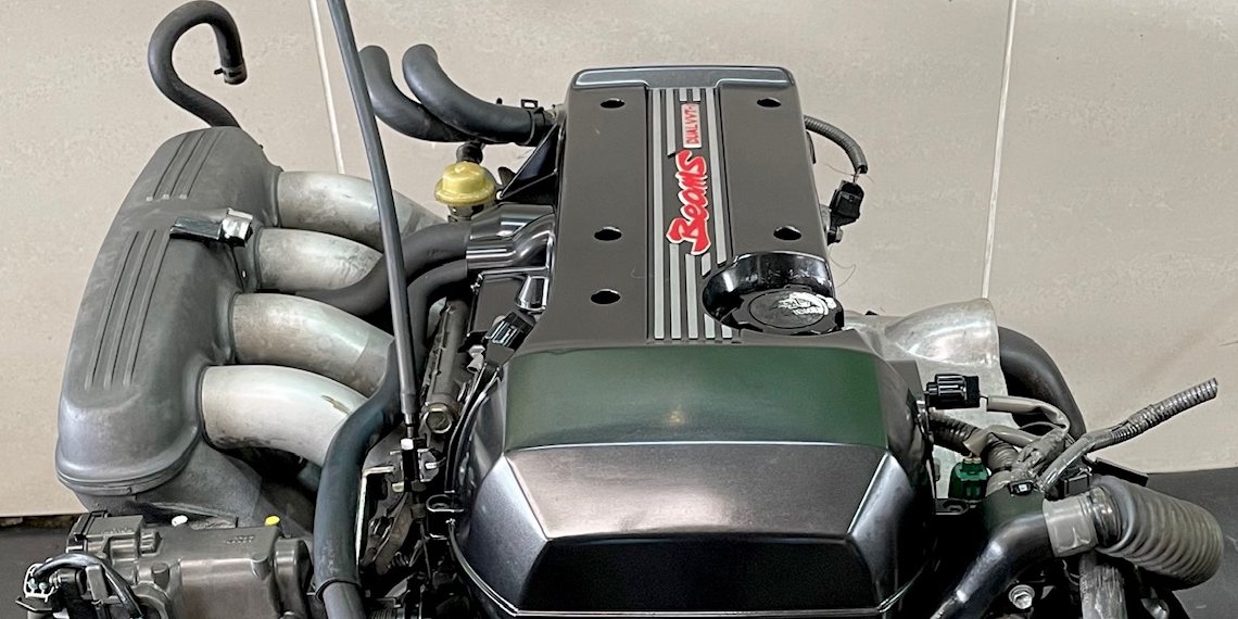 Toyota 3S-GE Beams Dual VVT-i engine with green cam cover